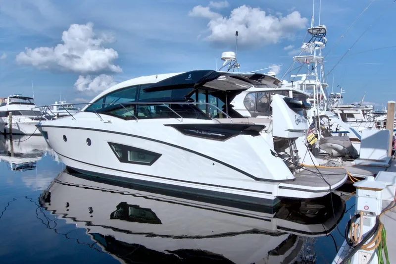 Slide: The Image of 2019 Beneteau Gran Turismo 50 yacht docked at marina under blue sky. - 95