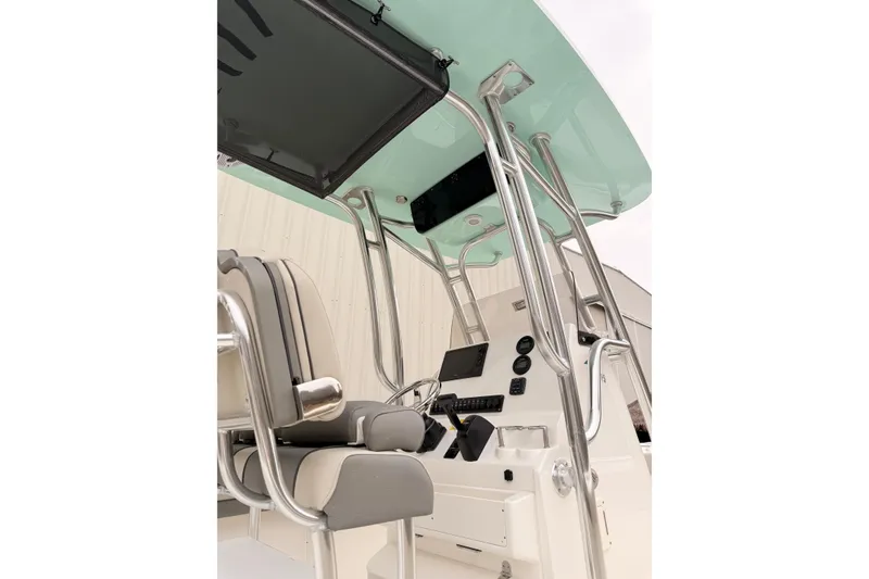 Slide: The Image of 2026 Key West 219 FS boat console with seating and controls, featuring a sleek design. - 5