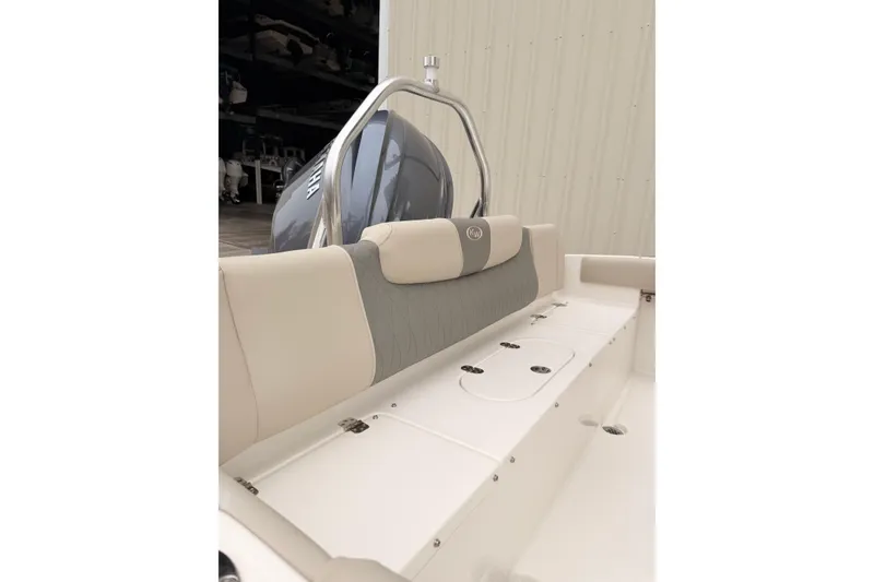 Slide: The Image of 2026 Key West 219 FS boat interior with Yamaha engine, featuring cushioned seating. - 6