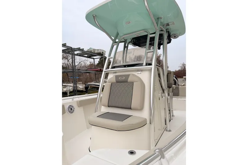 Slide: The Image of 2026 Key West 219 FS boat interior with cushioned seating and sleek design. - 8