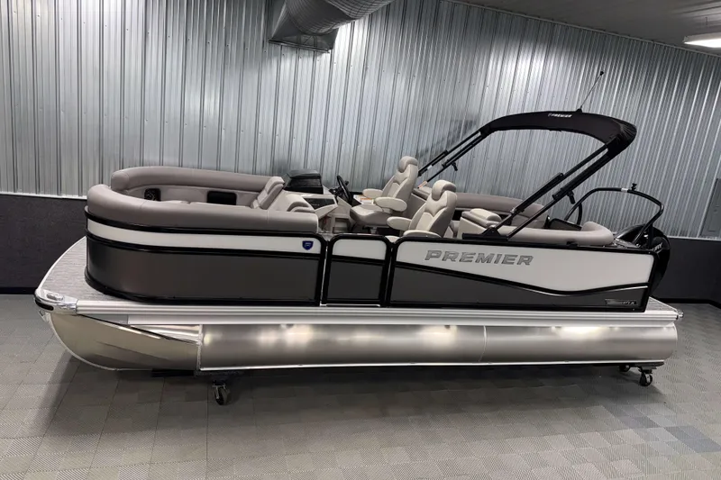 The Image of 2026 Premier 210 Sunsation RF Tritoon boat in showroom, sleek design, luxury seating. - 0