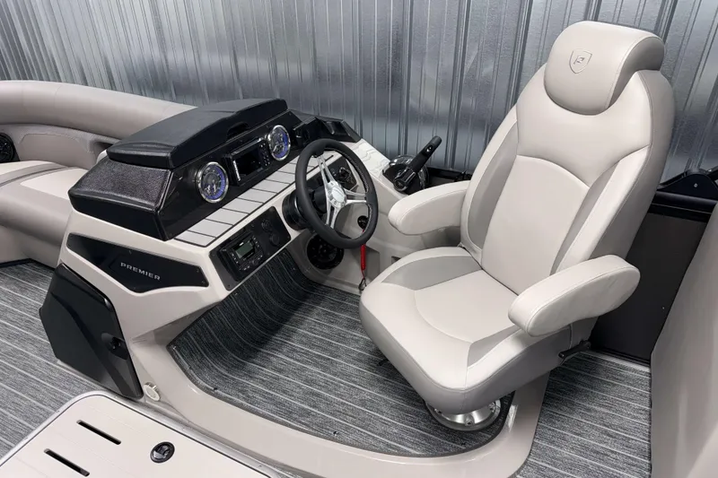 Slide: The Image of 2026 Premier 210 Sunsation RF Tritoon interior with modern helm and plush captain's chair. - 11