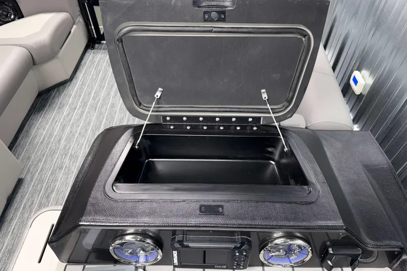 Slide: The Image of Open storage compartment on 2026 Premier 210 Sunsation RF Tritoon boat. - 13
