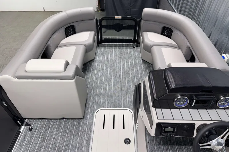 Slide: The Image of Luxurious interior of 2026 Premier 210 Sunsation RF Tritoon with plush seating and modern dashboard. - 18