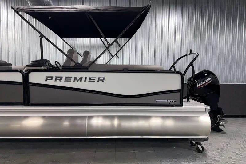 Slide: The Image of 2026 Premier 210 Sunsation RF Tritoon with Mercury engine in showroom. - 5