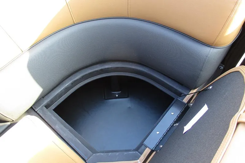 Slide: The Image of 2026 Bentley Pontoons Elite 223 Admiral storage compartment with tan and black upholstery. - 13