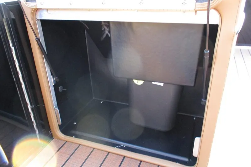 Slide: The Image of Storage compartment of 2026 Bentley Pontoons Elite 223 Admiral, featuring sleek interior design. - 15
