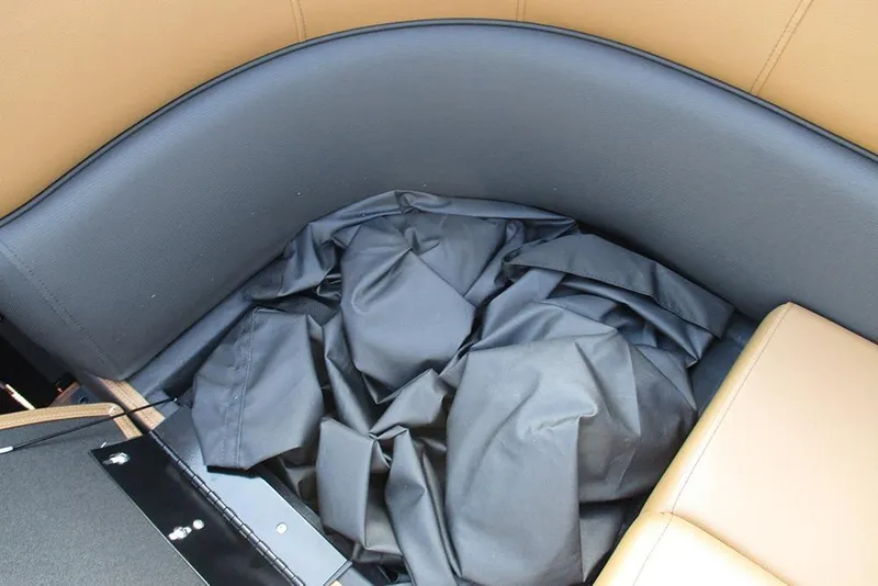 Slide: The Image of Bentley Pontoons Elite 223 Admiral 2026 interior with black fabric and tan seating. - 20