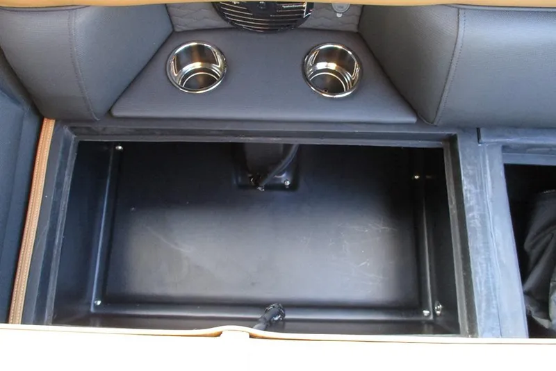 Slide: The Image of Interior storage compartment of 2026 Bentley Pontoons Elite 223 Admiral with cup holders. - 24
