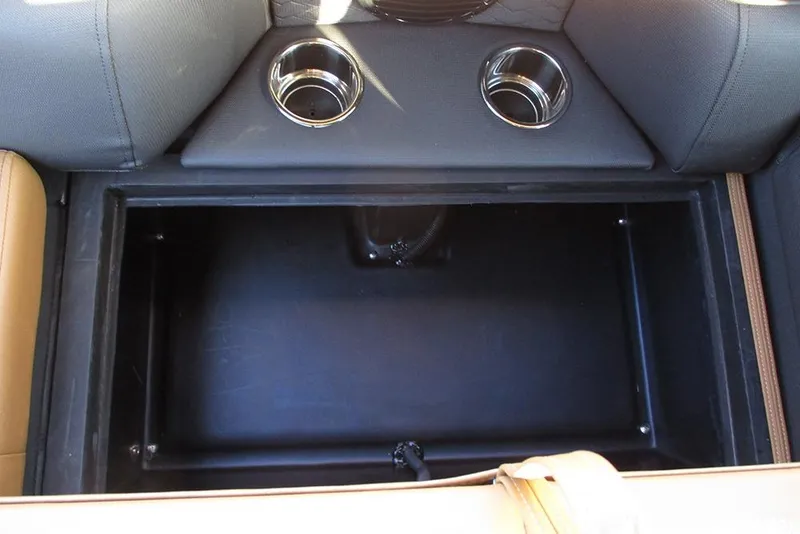 Slide: The Image of 2026 Bentley Pontoons Elite 223 Admiral storage compartment with cup holders. - 29