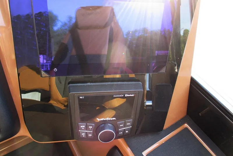 Slide: The Image of 2026 Bentley Pontoons Elite 223 Admiral dashboard with modern audio system and controls. - 33