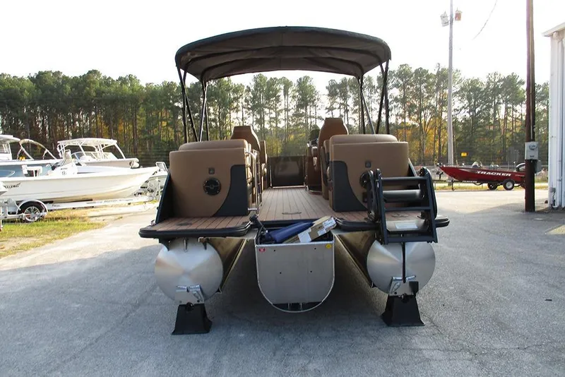 Slide: The Image of 2026 Bentley Pontoons Elite 223 Admiral pontoon boat, rear view, parked outdoors. - 7