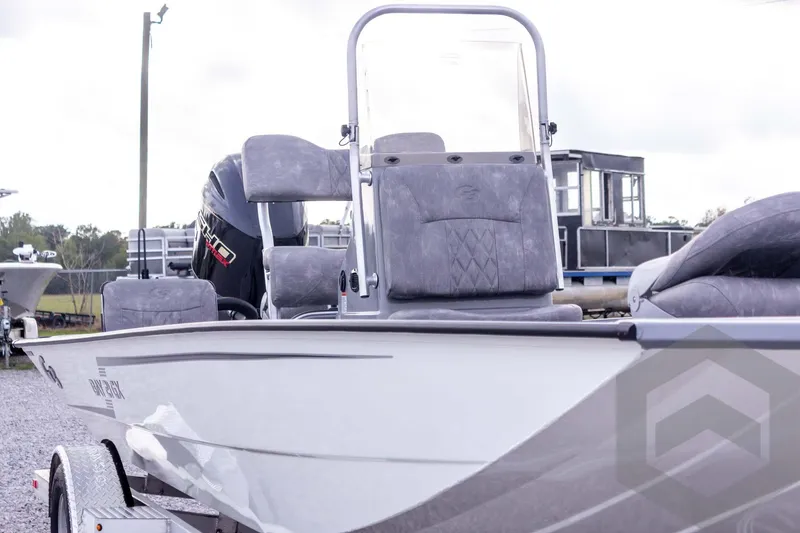 Slide: The Image of 2026 G3 Bay 21 GX boat with modern seating and powerful outboard motor. - 12