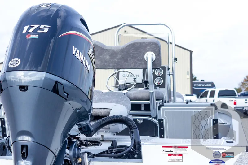 Slide: The Image of 2026 G3 Bay 21 GX boat with Yamaha 175 engine, parked outdoors. - 21