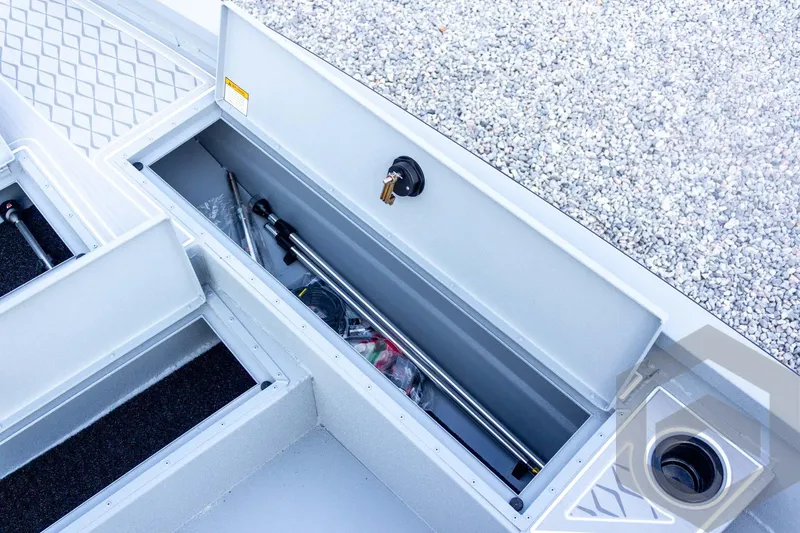 Slide: The Image of Storage compartment of 2026 G3 Bay 21 GX boat with fishing gear inside. - 29