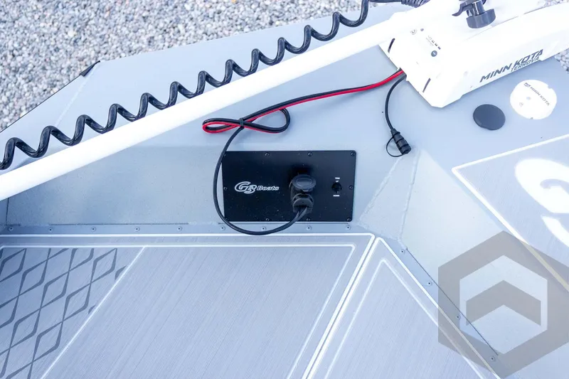 Slide: The Image of 2026 G3 Bay 21 GX boat deck with Minn Kota trolling motor and control panel. - 32