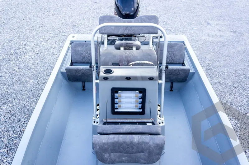 Slide: The Image of 2026 G3 Bay 21 GX boat interior with seating and control panel. - 36