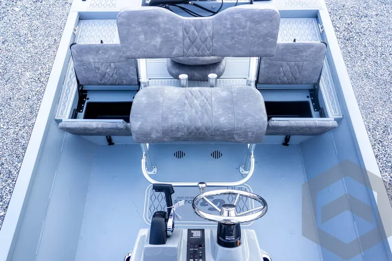 Slide: The Image of 2026 G3 Bay 21 GX boat interior with gray seating and steering console. - 40