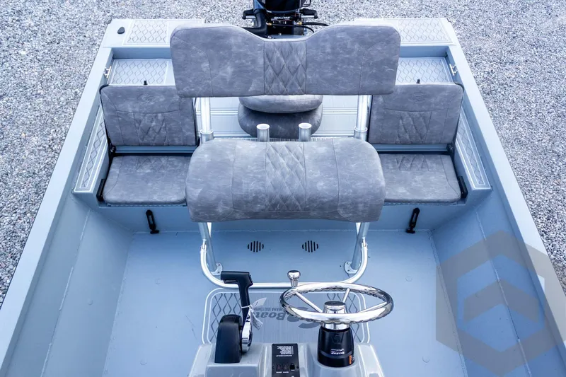 Slide: The Image of Interior view of 2026 G3 Bay 21 GX boat with gray seating and steering wheel. - 41