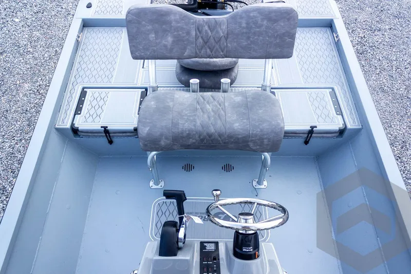 Slide: The Image of 2026 G3 Bay 21 GX boat interior with dual seats and steering wheel. - 42