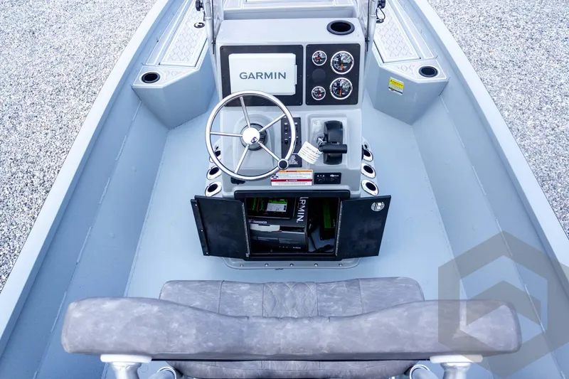 Slide: The Image of 2026 G3 Bay 21 GX boat console with Garmin navigation and steering wheel. - 44