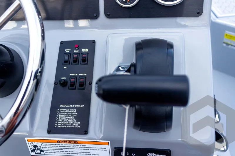 Slide: The Image of Control panel of 2026 G3 Bay 21 GX boat with switches and checklist. - 48