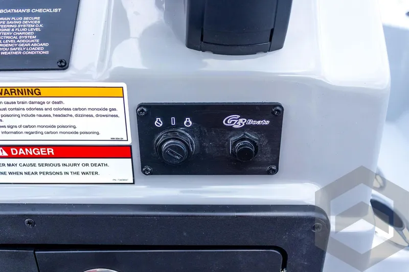 Slide: The Image of Control panel of 2026 G3 Bay 21 GX boat with warning labels. - 49