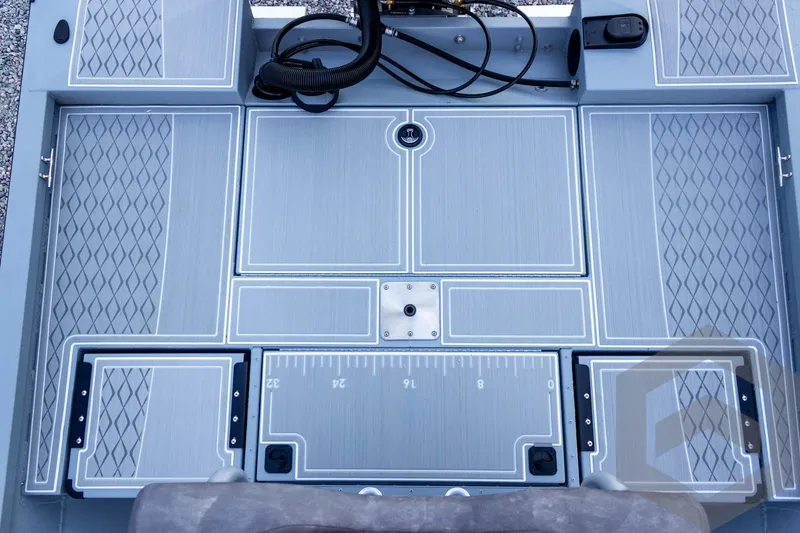 Slide: The Image of 2026 G3 Bay 21 GX boat deck with textured flooring and integrated measurement ruler. - 50