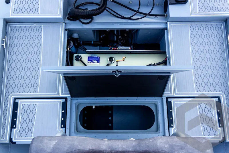 Slide: The Image of 2026 G3 Bay 21 GX boat interior showing open storage compartments and wiring. - 51