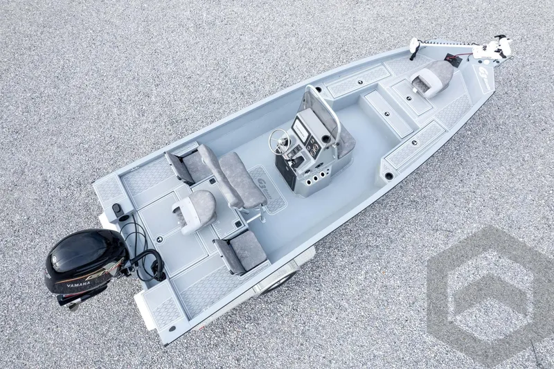 Slide: The Image of 2026 G3 Bay 21 GX boat with Yamaha motor, aerial view on gravel surface. - 62