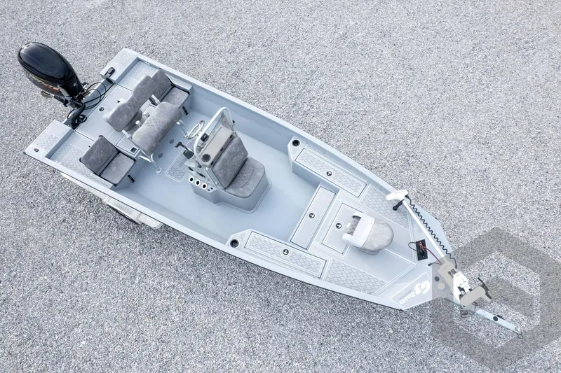 Slide: The Image of 2026 G3 Bay 21 GX boat, aerial view, showcasing seating and motor on gravel surface. - 64