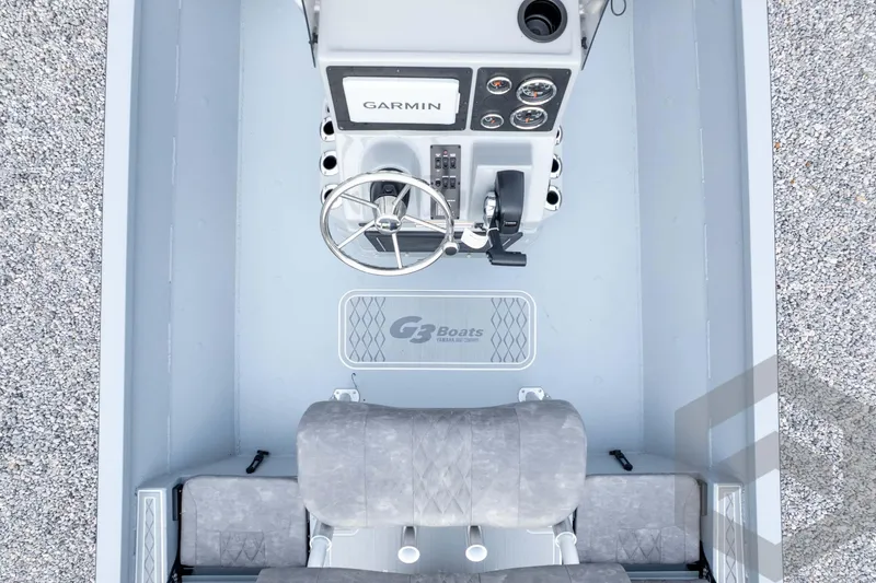 Slide: The Image of 2026 G3 Bay 21 GX boat interior with Garmin dashboard and dual seating. - 66