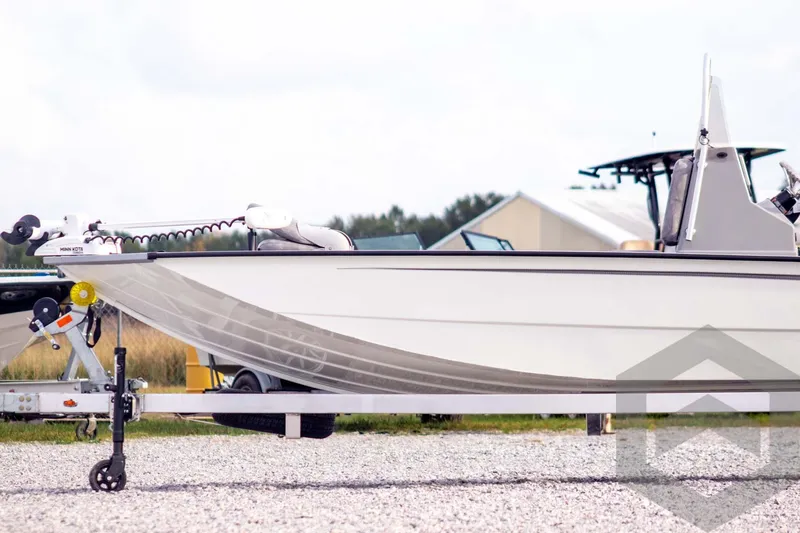 Slide: The Image of 2026 G3 Bay 21 GX boat on trailer, side view, outdoors. - 9