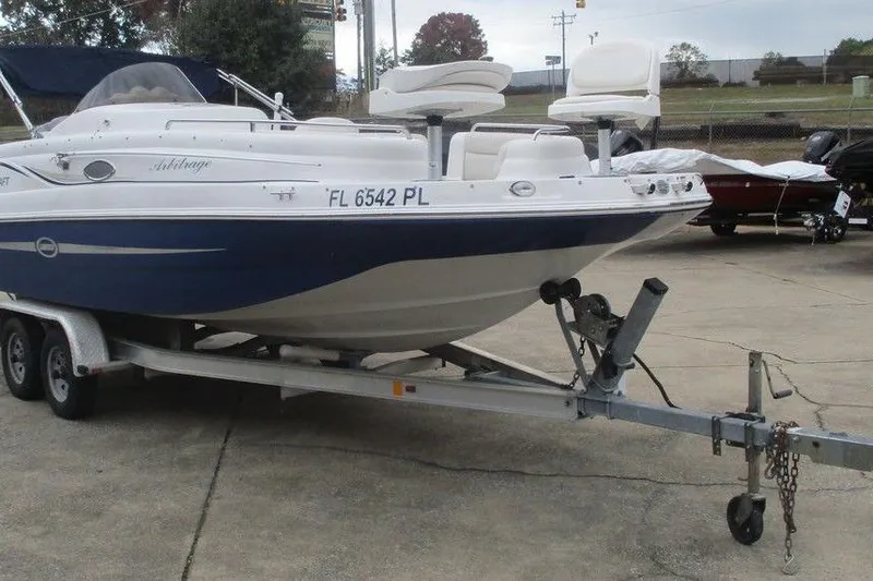 Slide: The Image of 2012 Starcraft 2009 OB Limited boat on trailer, parked outdoors. - 4