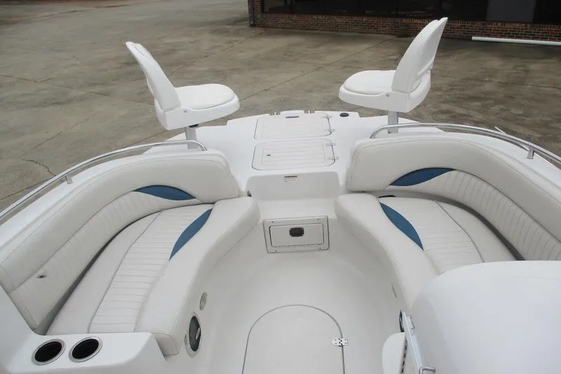 Slide: The Image of Luxurious seating on 2012 Starcraft 2009 OB Limited boat, featuring white and blue upholstery. - 5