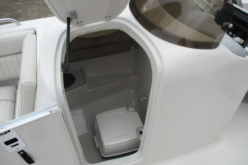 Slide: The Image of Interior view of a 2012 Starcraft 2009 OB Limited boat with open storage compartment. - 8