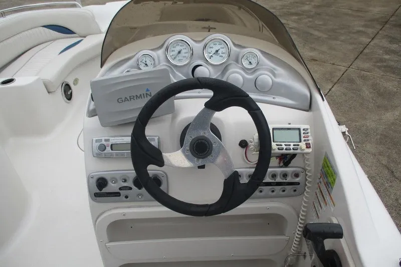 Slide: The Image of Steering console of 2012 Starcraft 2009 OB Limited boat with Garmin navigation system. - 9