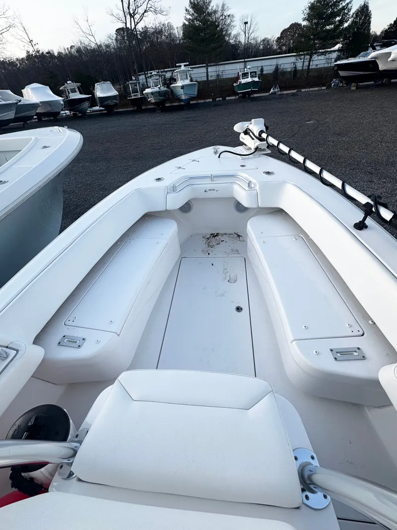 Slide: The Image of 2024 Contender 25 Tournament CC boat interior with seating and storage compartments. - 8