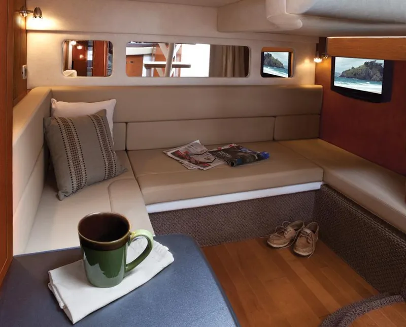 Slide: The Image of Manufacturer Provided Image: Interior of 2012 Sea Ray 330 Sundancer yacht with cozy seating area. - 17