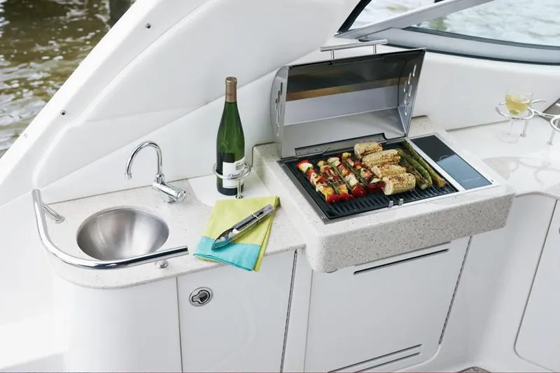 Slide: The Image of Manufacturer Provided Image: Outdoor kitchen on a 2012 Sea Ray 330 Sundancer yacht with grill and sink. - 4