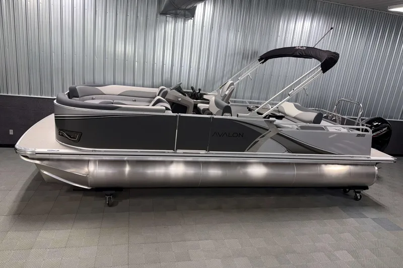 The Image of 2026 Avalon LSZ 2385 Entertainer pontoon boat in showroom, sleek design, gray interior. - 0