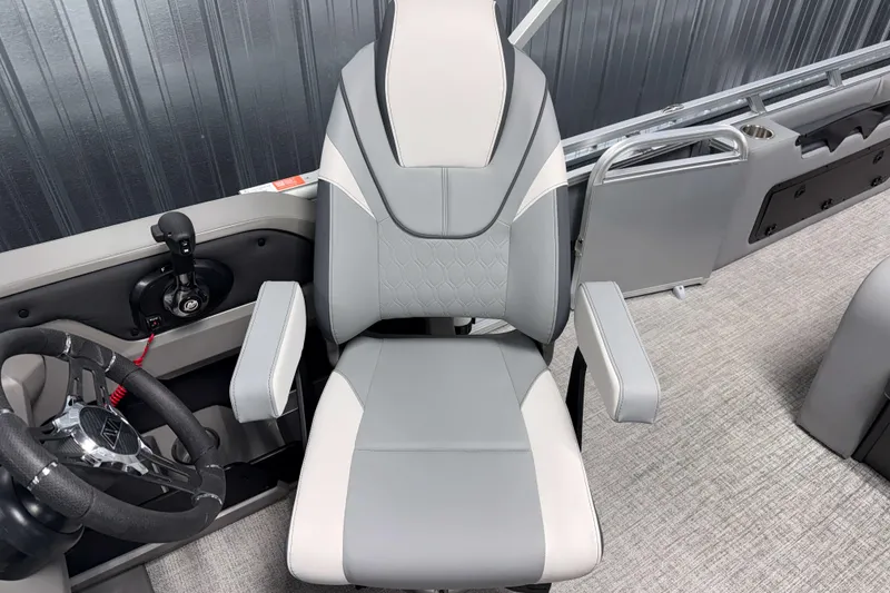 Slide: The Image of Captain's chair and helm of 2026 Avalon LSZ 2385 Entertainer pontoon boat. - 10
