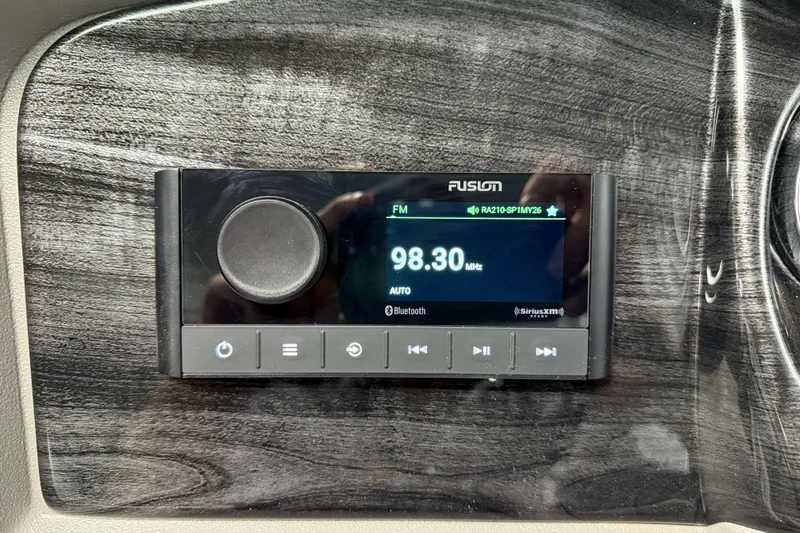 Slide: The Image of 2026 Avalon LSZ 2385 Entertainer stereo system displaying FM radio at 98.30 MHz. - 13