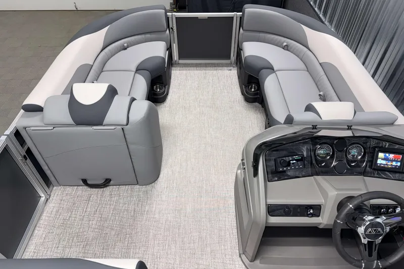 Slide: The Image of 2026 Avalon LSZ 2385 Entertainer pontoon boat interior with plush seating and modern dashboard. - 17