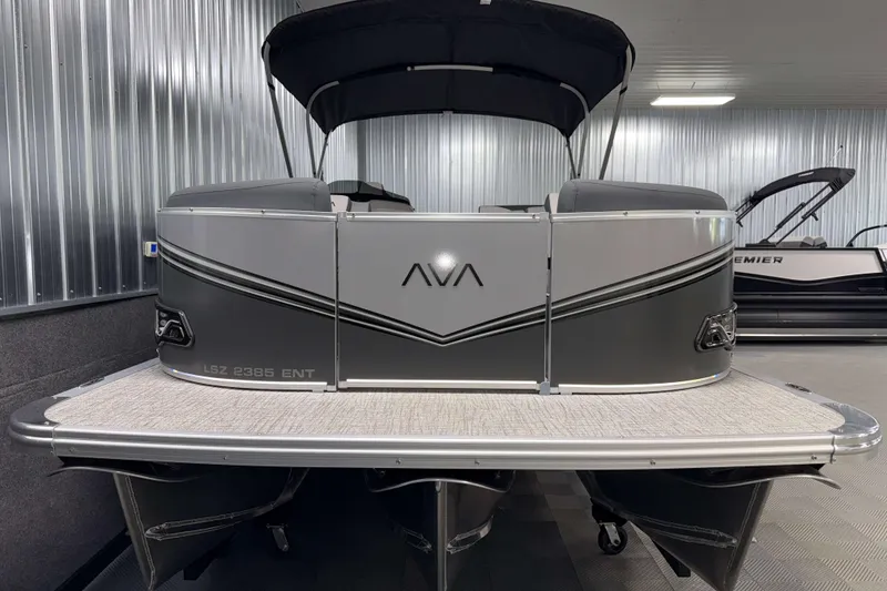 Slide: The Image of 2026 Avalon LSZ 2385 Entertainer pontoon boat in showroom, rear view. - 21