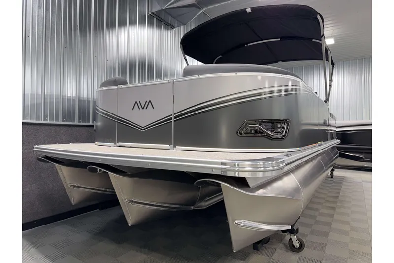 Slide: The Image of 2026 Avalon LSZ 2385 Entertainer pontoon boat in a showroom setting. - 22