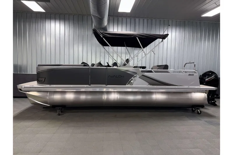Slide: The Image of 2026 Avalon LSZ 2385 Entertainer pontoon boat in a showroom, side view. - 24