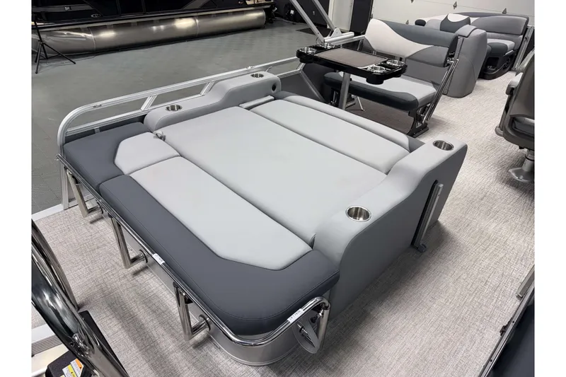 Slide: The Image of 2026 Avalon LSZ 2385 Entertainer boat interior with luxurious seating and cup holders. - 5