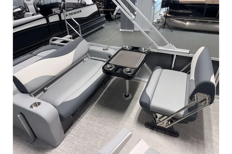 Slide: The Image of 2026 Avalon LSZ 2385 Entertainer boat interior with gray seating and table. - 6