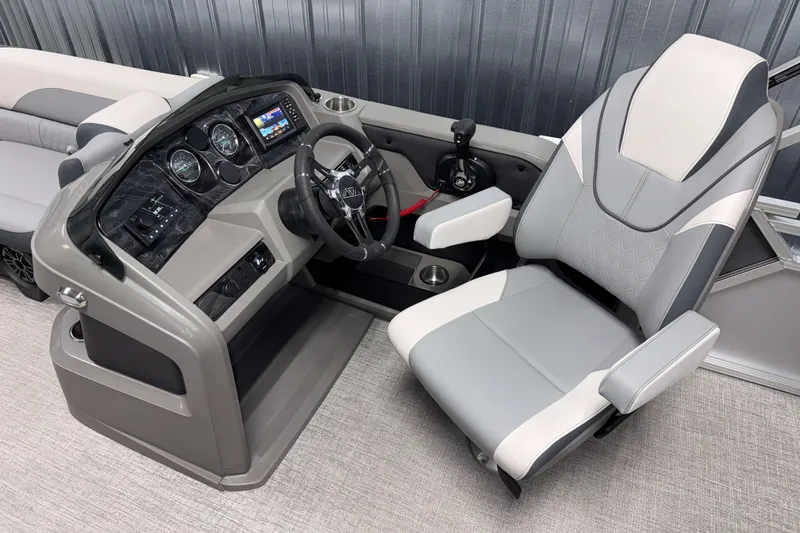 Slide: The Image of 2026 Avalon LSZ 2385 Entertainer boat cockpit with modern steering and comfortable seating. - 8